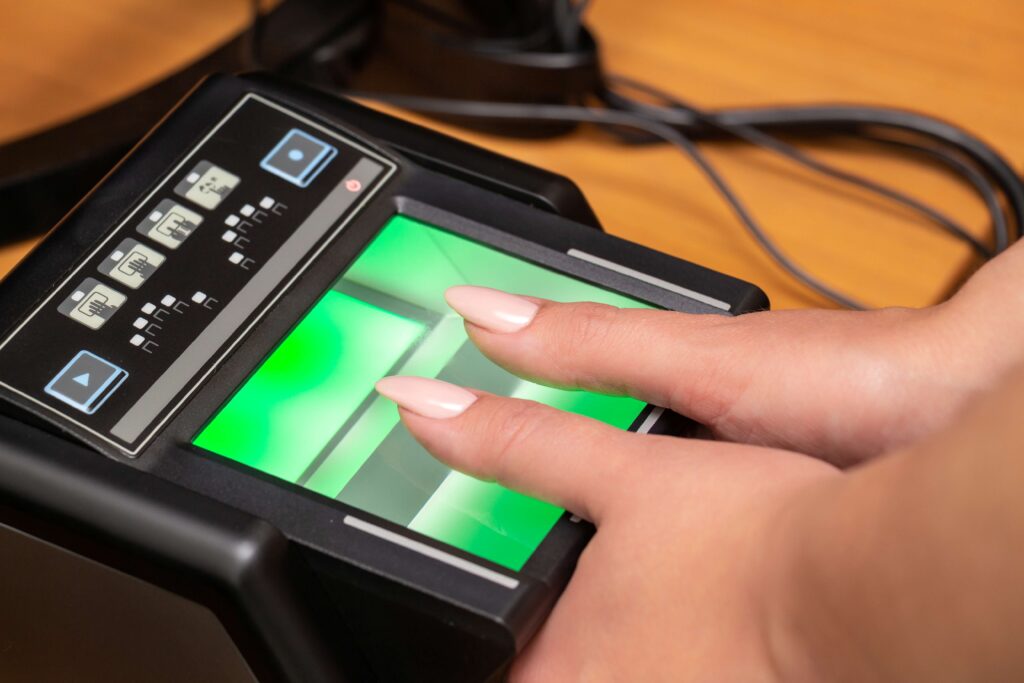 Fingerprints being captured on a Live Scan fingerprint scanner for a background check